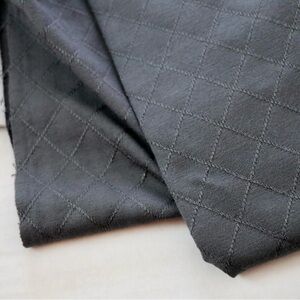 Dark grey “quilted look” activewear knit fabric, 2 yards over